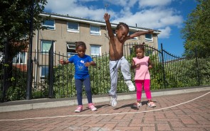 Three children skipping
