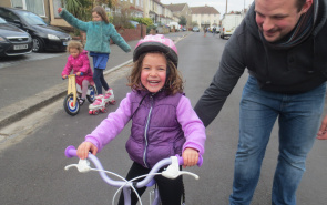 Happy child riding bike