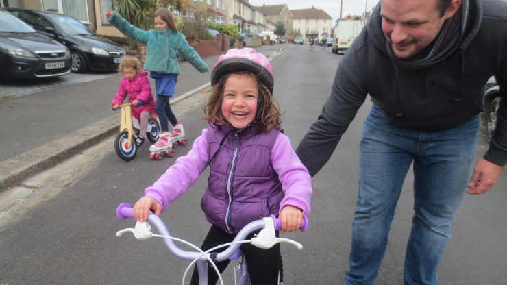 Learning to ride a bike Happy child riding bike