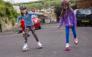 Two girls rollerskating
