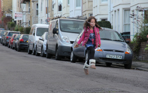 Girl skipping playing out alone
