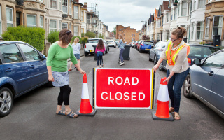 Stewards closing the road