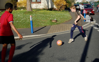 Playing football in the street