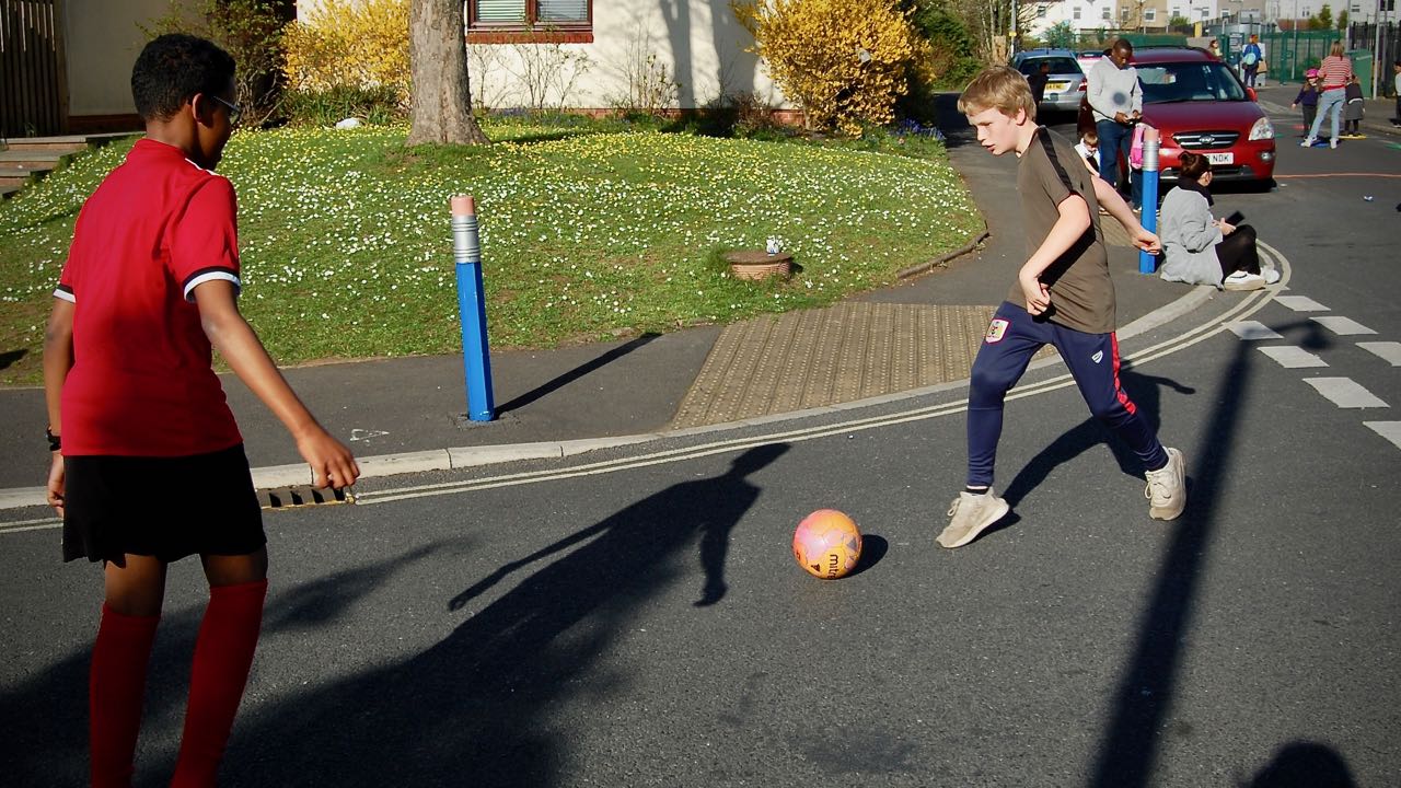 Playing football in the street