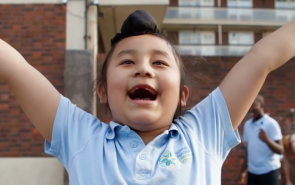 happy child with raised arms
