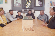 TAP Project discussion group A group of people sitting around a table discussing a film that they